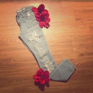 Light blue distressed boyfriend jeans.
